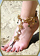 Crystabel slave anklet shown in gold-tone w/emerald green beads
